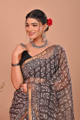 BLACK HANDCRAFTED KOTA DORIA SAREE WITH GOLDEN ZARI BORDER & WHITE FLORAL PRINT